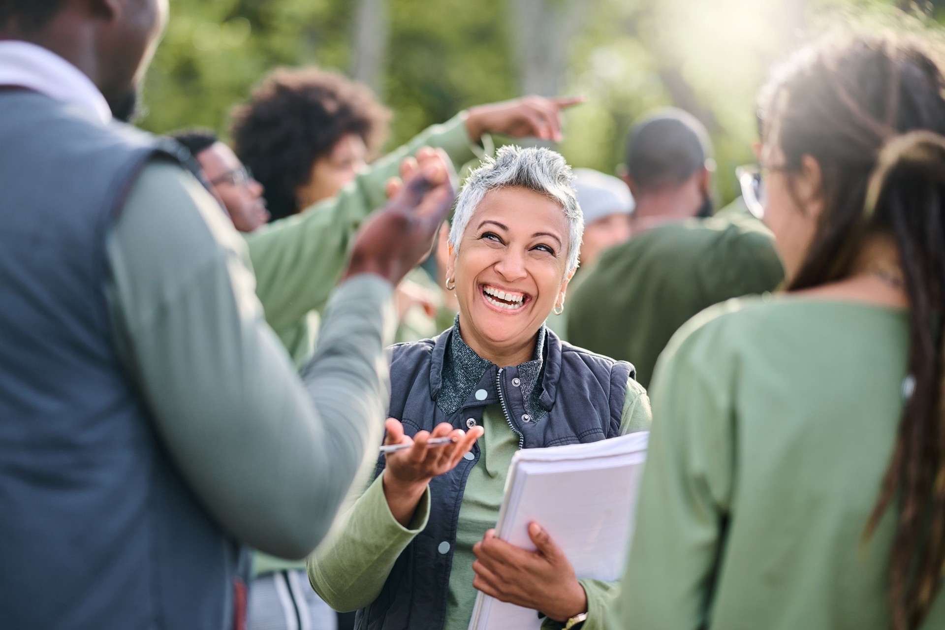 Volunteer, team and people in nature for community service, teamwork and planning with leadership, goals and strategy. Senior person or leader for management in forest, park or eco friendly project